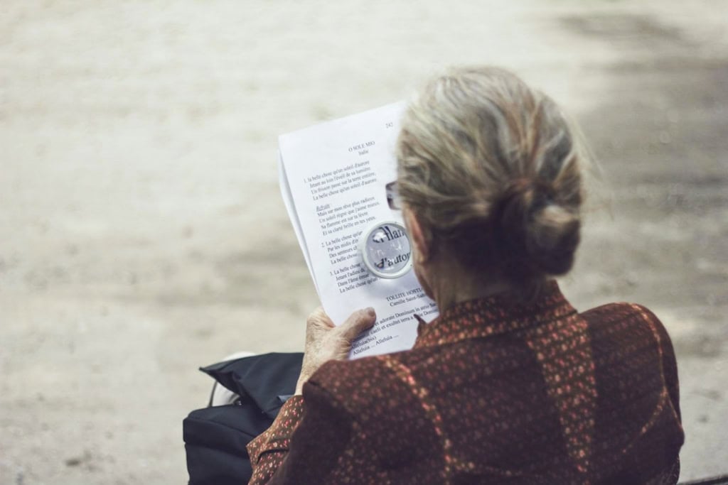 A person reading a home insurance policy declaration page - Home insurance premium comparison