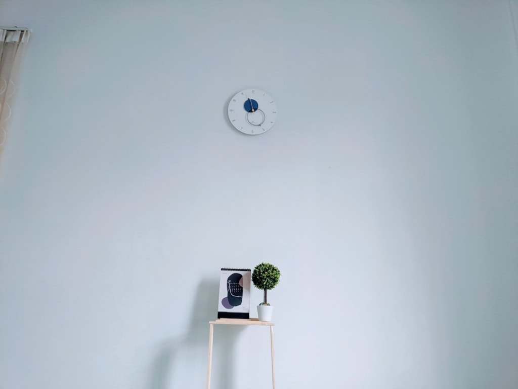 A home security system keypad mounted on a wall - Home insurance premium comparison